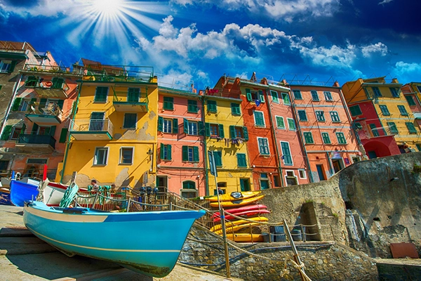 Cinque Terre. Beautiful view of the port with boats and colourful homes.