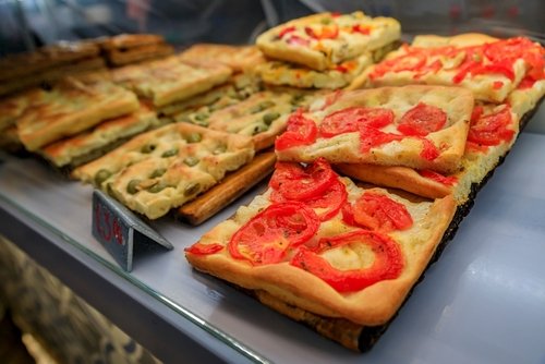 Selection of freshly made focaccia, traditional local flat bread at a restaurant in old town of Manarola in Cinque Terre on Mediterranean Sea, Italy