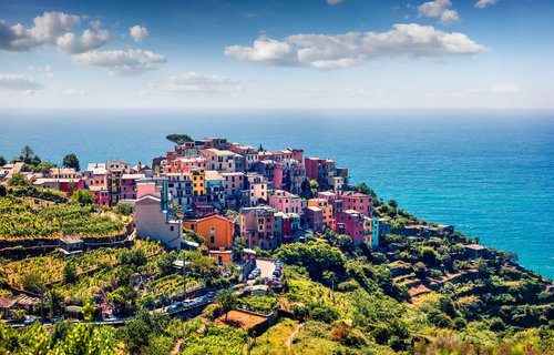 Third village of the Cique Terre sequence of hill cities - Corniglia. Colorful spring morning in Liguria, Italy, Europe. Picturesqie seascape of Mediterranean sea. Traveling concept background.